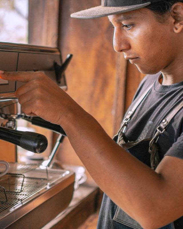 A barista making espresso